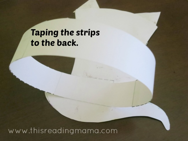 taping strips on the back of hat