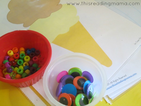 adding pony beads and googly eyes to playdough play