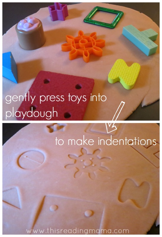 using toys to make indentations in playdough