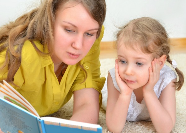 parent reading aloud to child