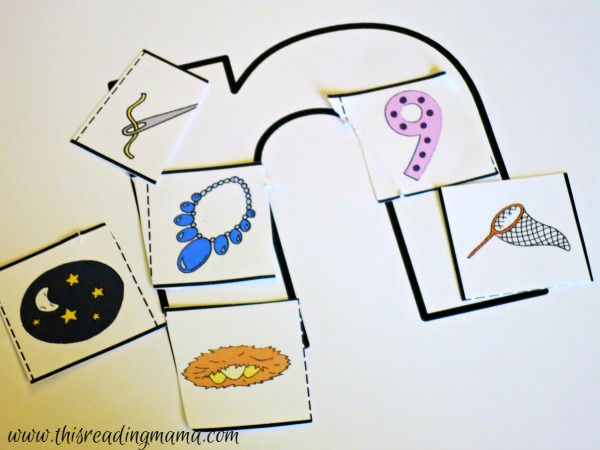 gluing down alphabet picture cards on letters