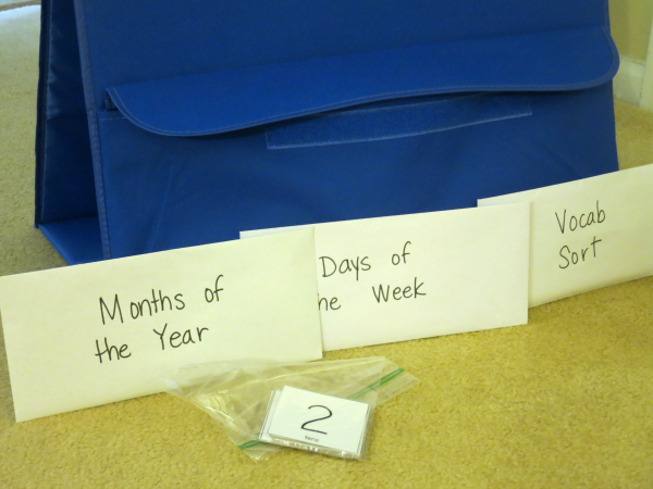 storing the calendar vocabulary cards in back of the pocket chart