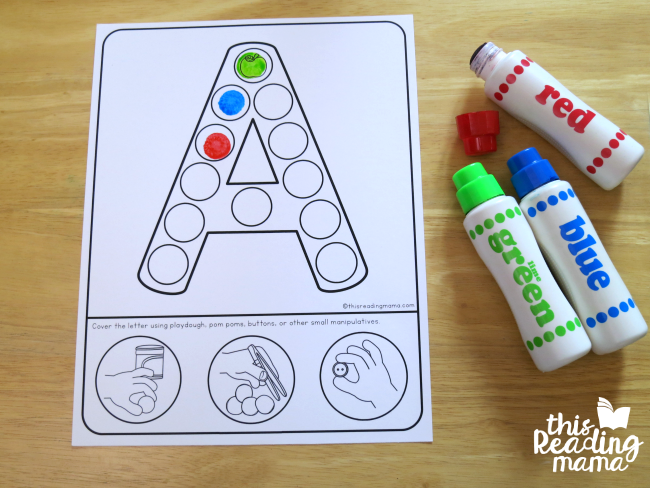 using dot paint to cover the fine motor alphabet mats