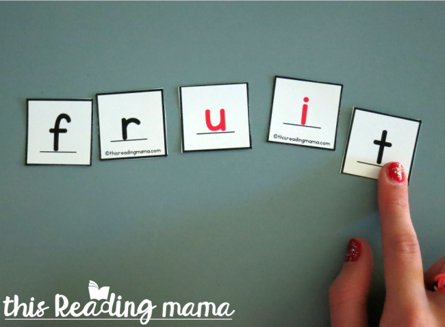 spelling words with alphabet letter tiles
